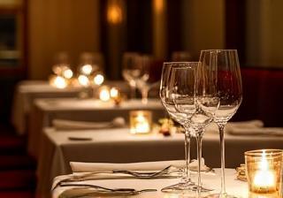 Beautifully set tables in an elegant private dining room at the trattoria
